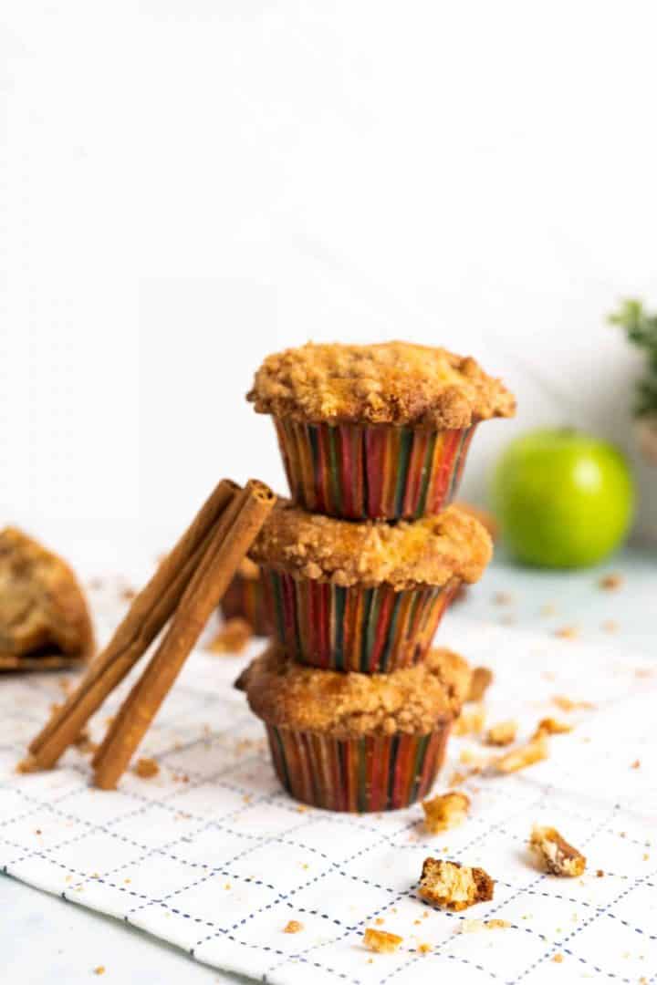 Apple muffins stacked on each other.