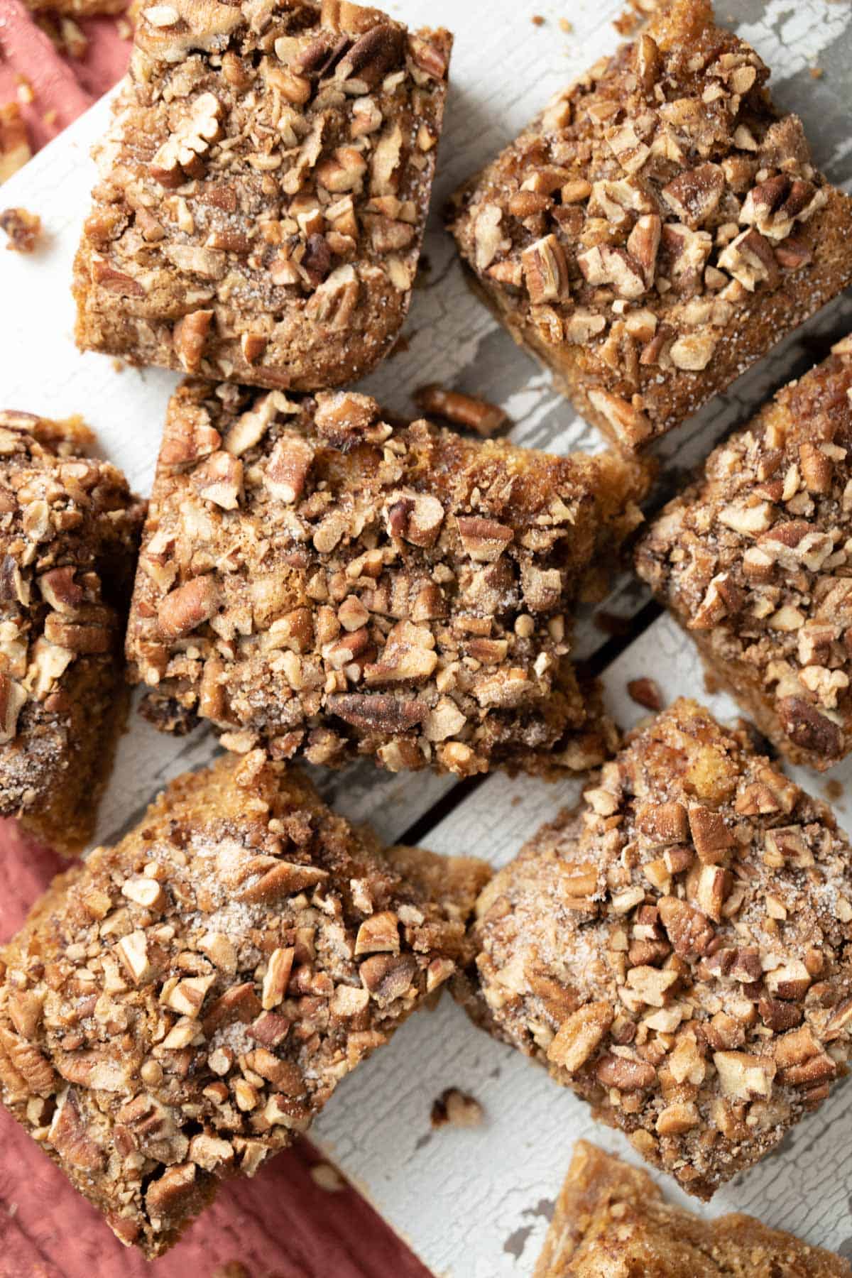 close up shot of the pieces of brown sugar pecan coffee cake placed on a white board.