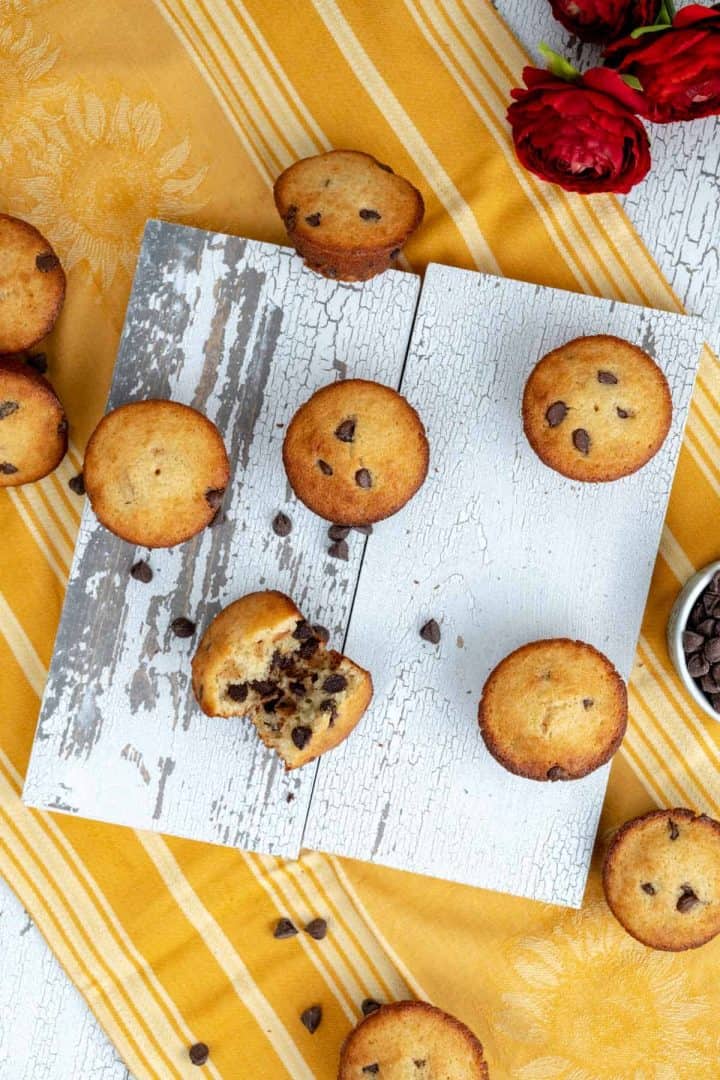 Over the head shot of the scattered chocolate chip muffins.