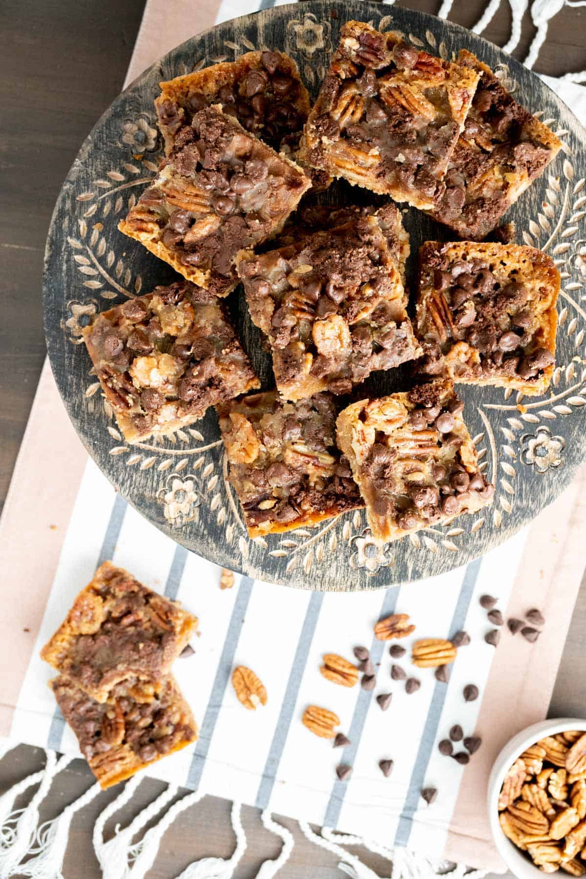 Over the head shot of turtle cookies in a cake plate. 