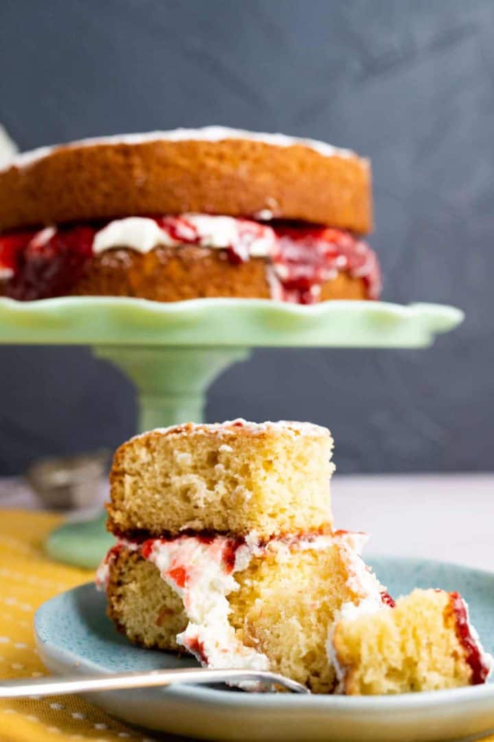 Victoria Sponge Cake on small plate with spoon.