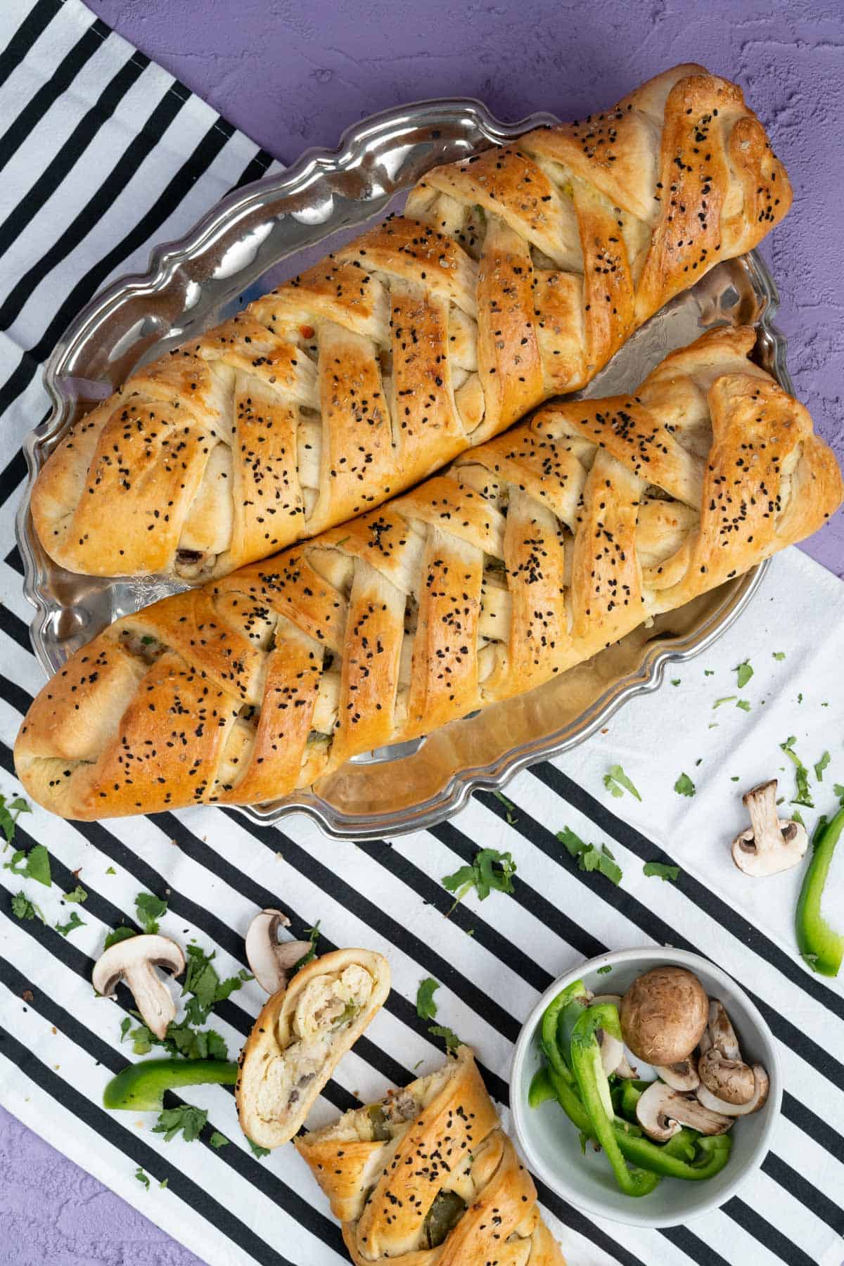 overhead shot of two chicken breads in a silver tray.