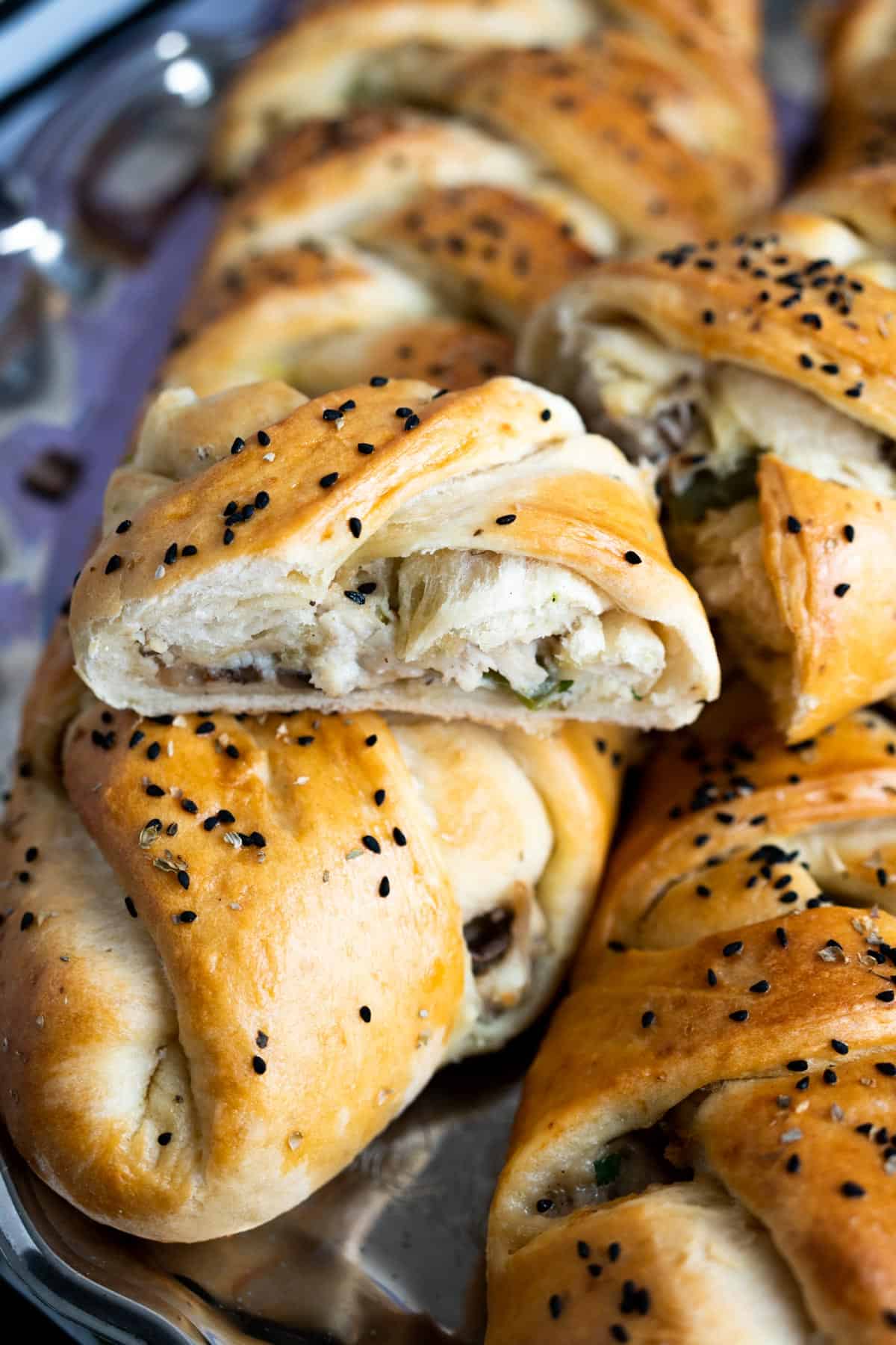 chicken bread's piece showing the texture of the chicken filling inside. 