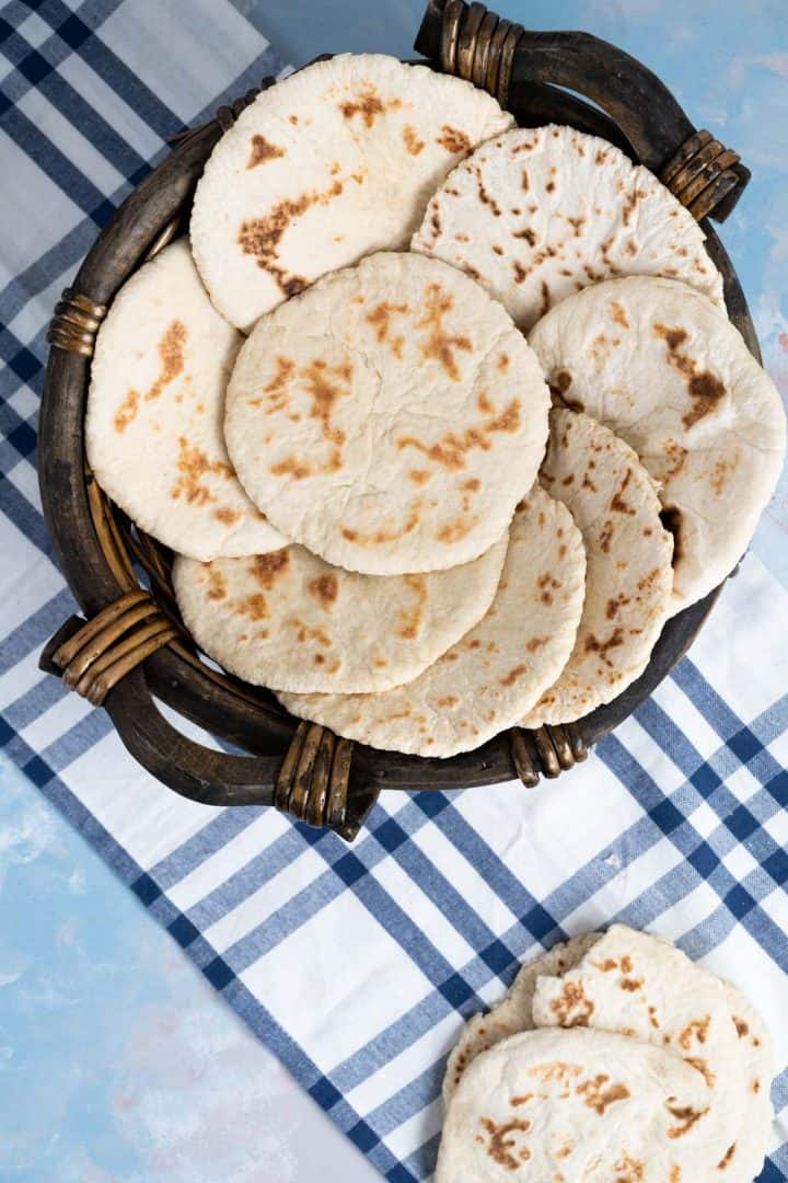 pita bread in a wooden bowl.