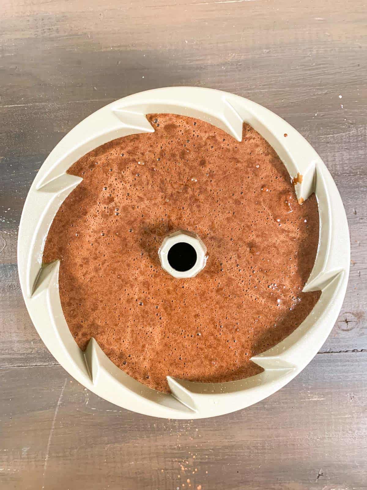 chocolate bundt cake batter in the bundt pan ready to go to oven.