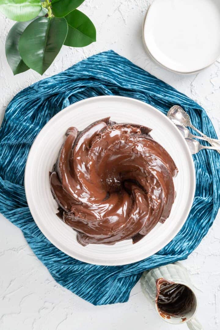 Over the head shot with chocolate bundt cake covered with silky chocolate frosting.