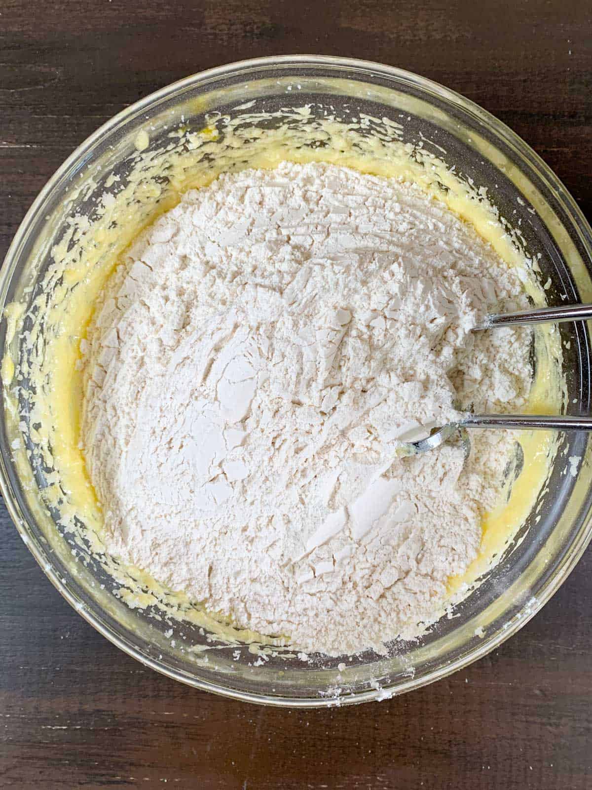 incorporating wet and dry ingredients for pinwheel cookies.