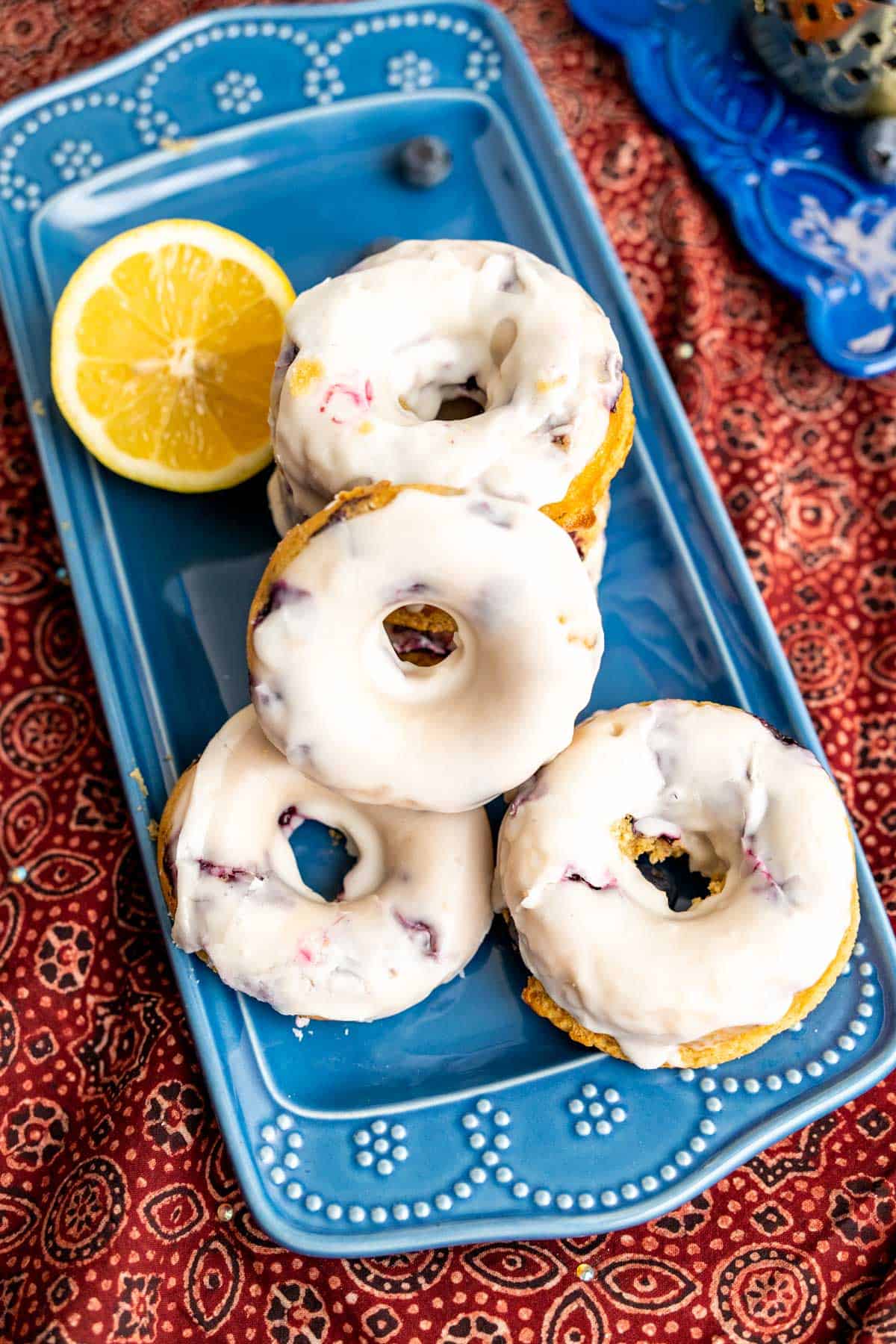 over the head shot of the donuts on the red table cloth.