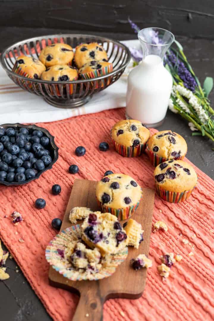 closely showing the muffins on the table with milk bottle in the backdrop.