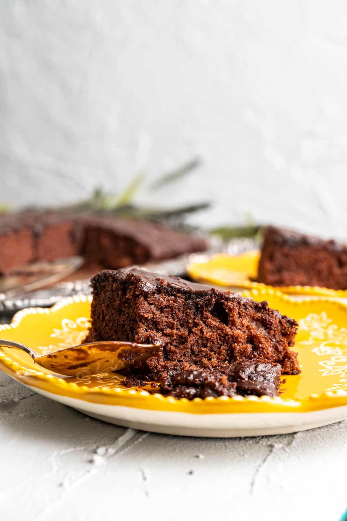 close shot of coke cake sitting in a yellow plate.