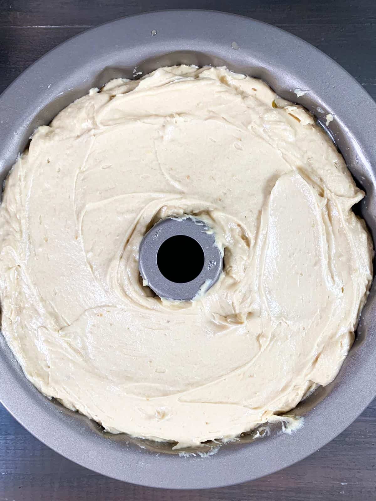 cake batter in the bundt pan ready to go in the oven.