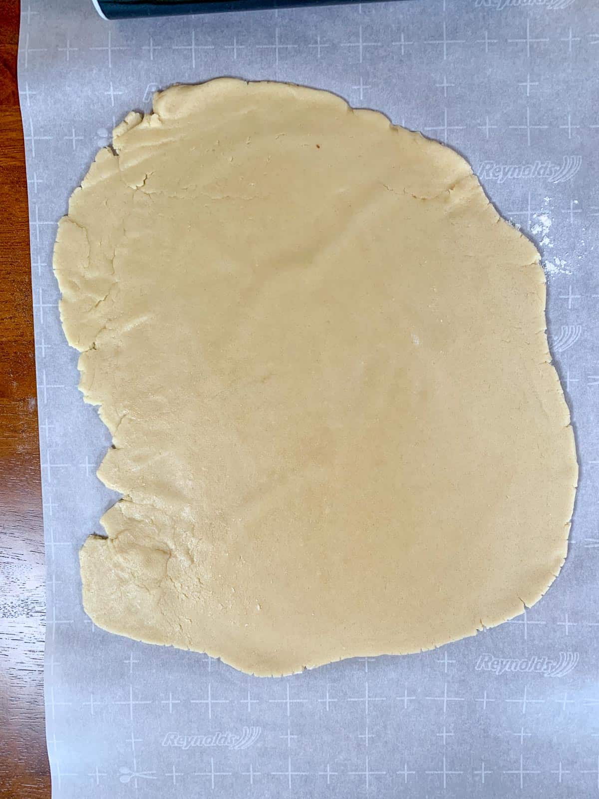 over the head shot of the rolled out vanilla dough for pinwheel cookies.