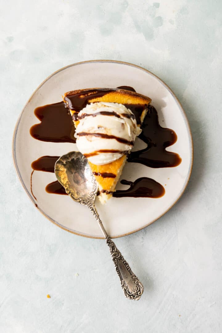 over head shot of the slice of butter cake on a white plate.