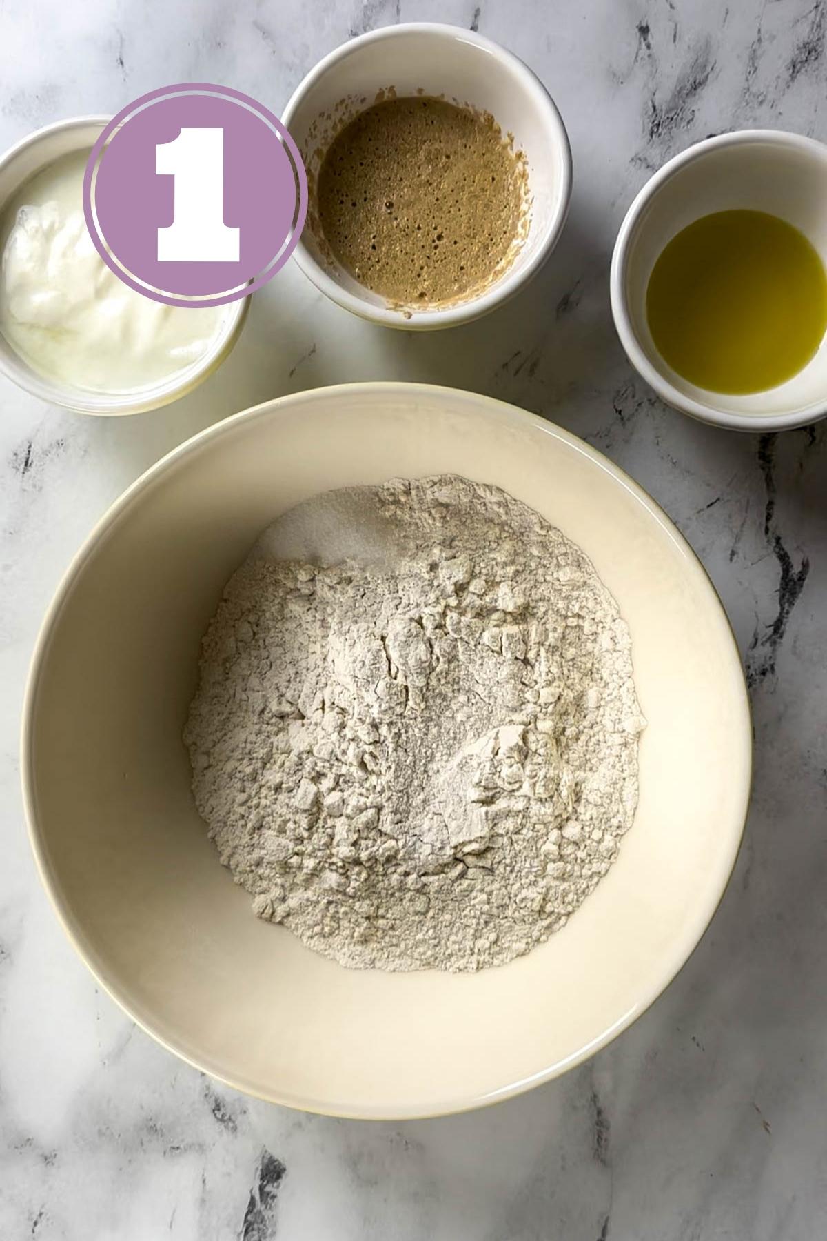 the ingredients for turkish bread seen on a marble slab.