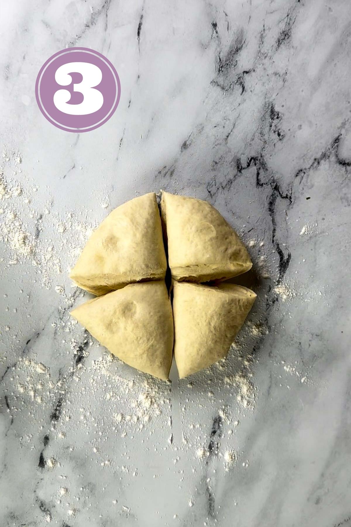 turkish bread dough divided in four equal balls on the table.