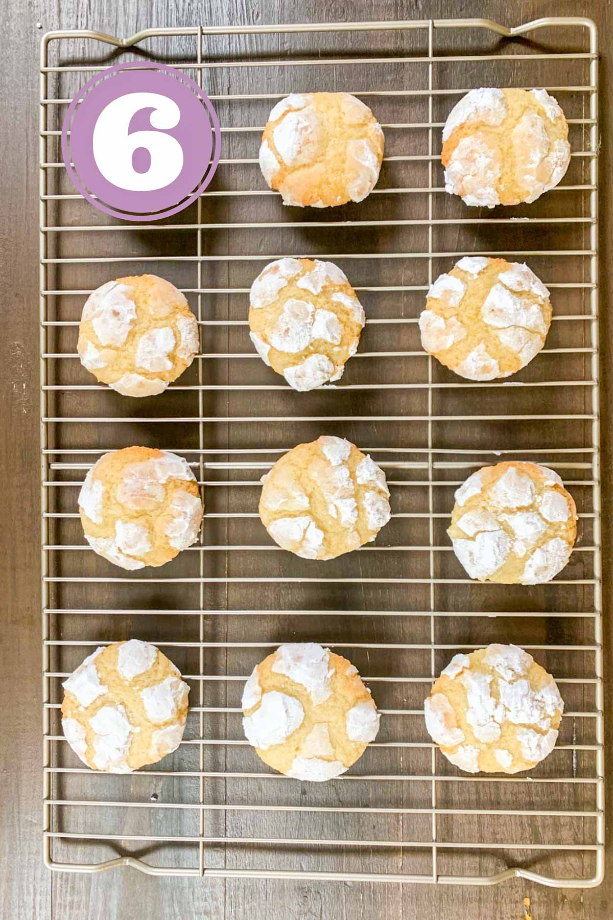 baked lemon crinkle cookies on the cooling tray out of the oven.