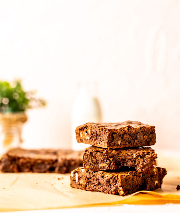 three overlapped condensed milk brownies on each other.