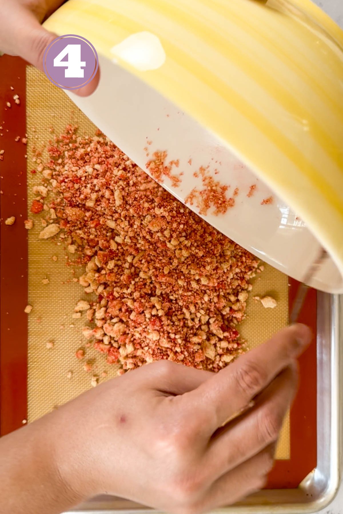 spreading the mixture on a silicone mat placed in a baking tray.