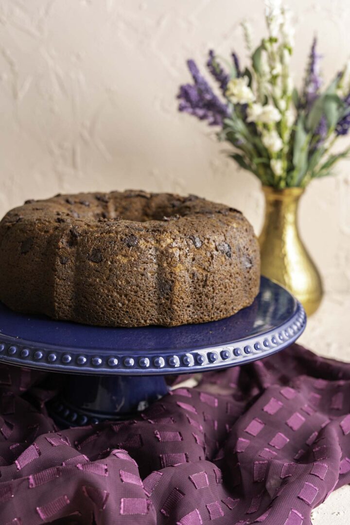 banana chocolate chip bundt cake on a cake stand.