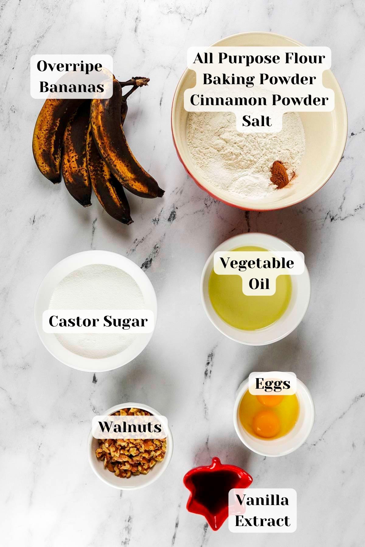 ingredients placed over a marble slab for banana bread.