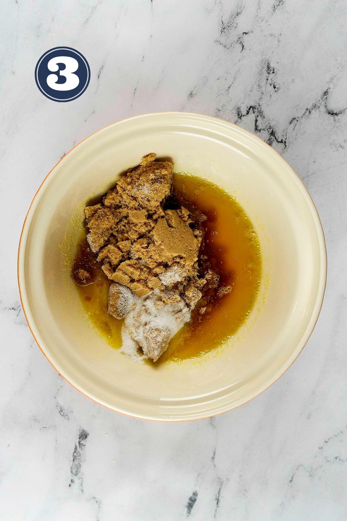 brown and castor sugar added to the melted butter in a mixing bowl.