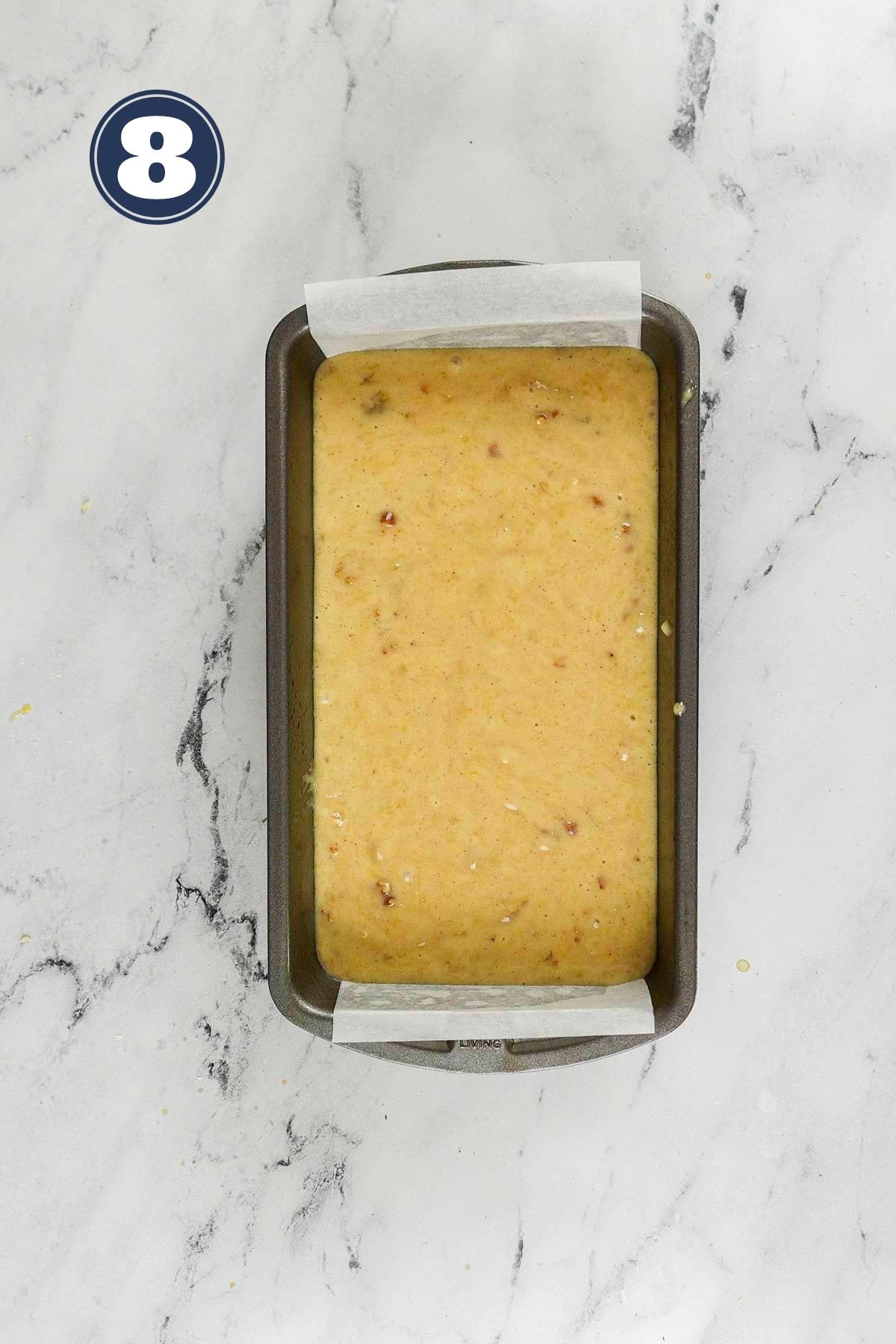 Banana bread batter poured into 9 x 5 inch pan ready to go to the oven.