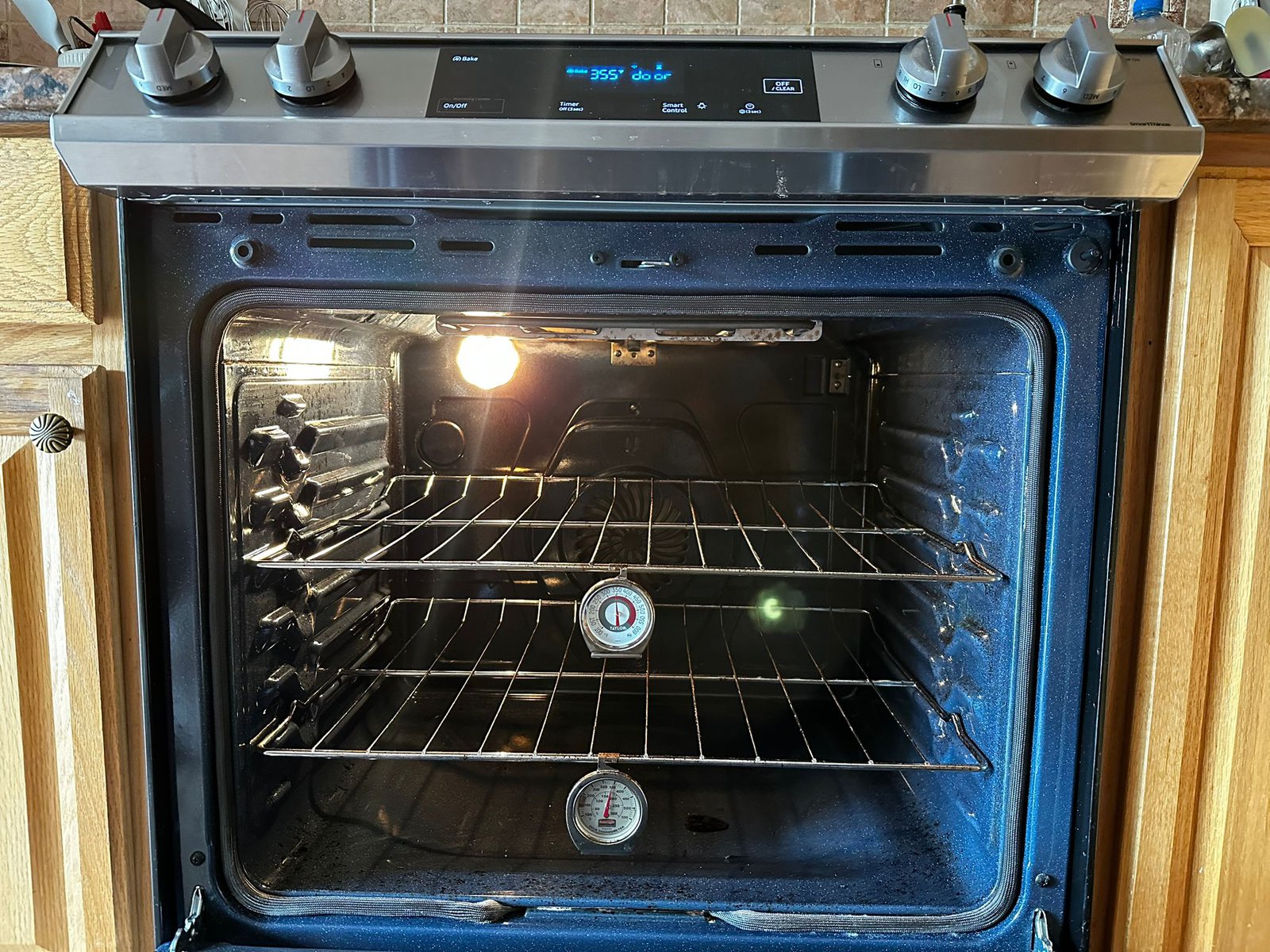 oven set at 355 F and the oven thermometer showing 350 F inside the oven. 