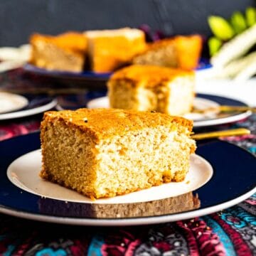 a piece of desi ghee cake in a plate.