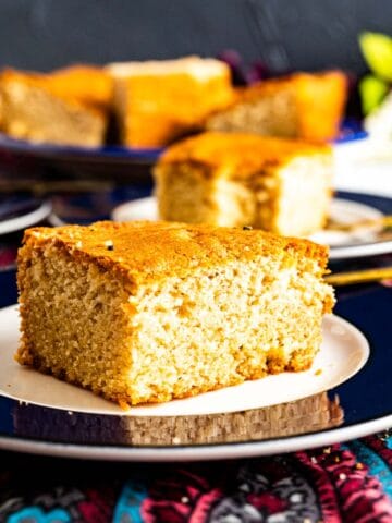 a piece of desi ghee cake in a plate.