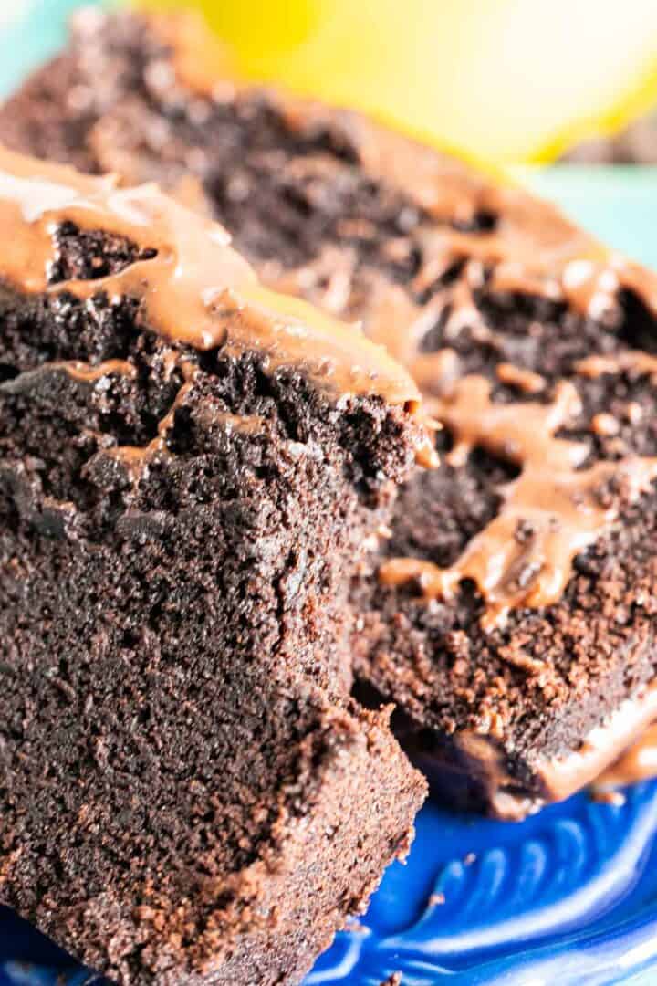 close shot of two chocolate cake slices sitting in a plate.