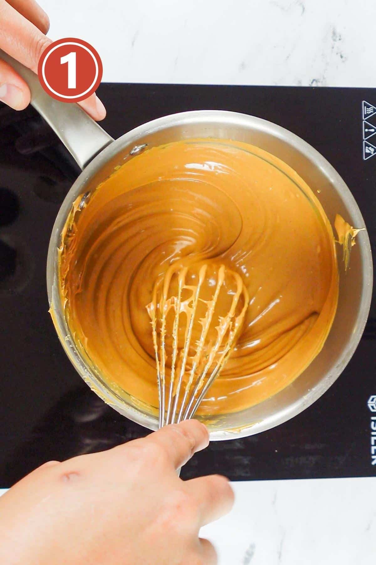 heating up the peanut butter in the sauce pan.