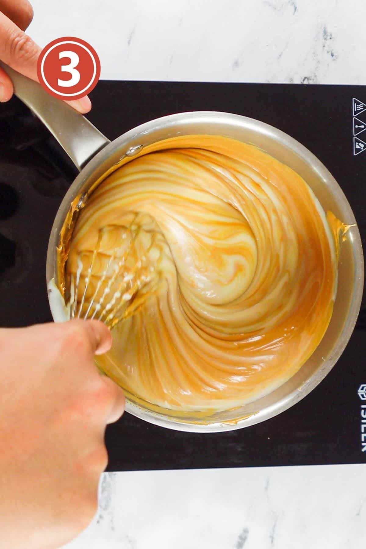 stirring peanut butter and condensed milk on the heat together.