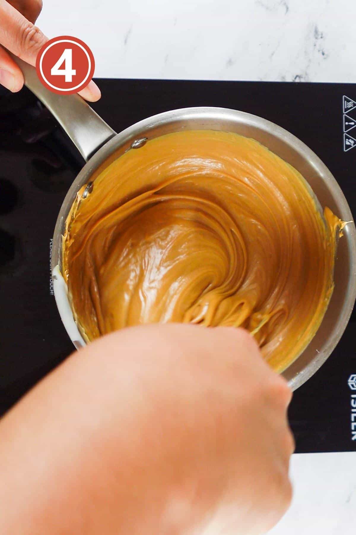 mixing the peanut butter fudge ingredients together over the stove.