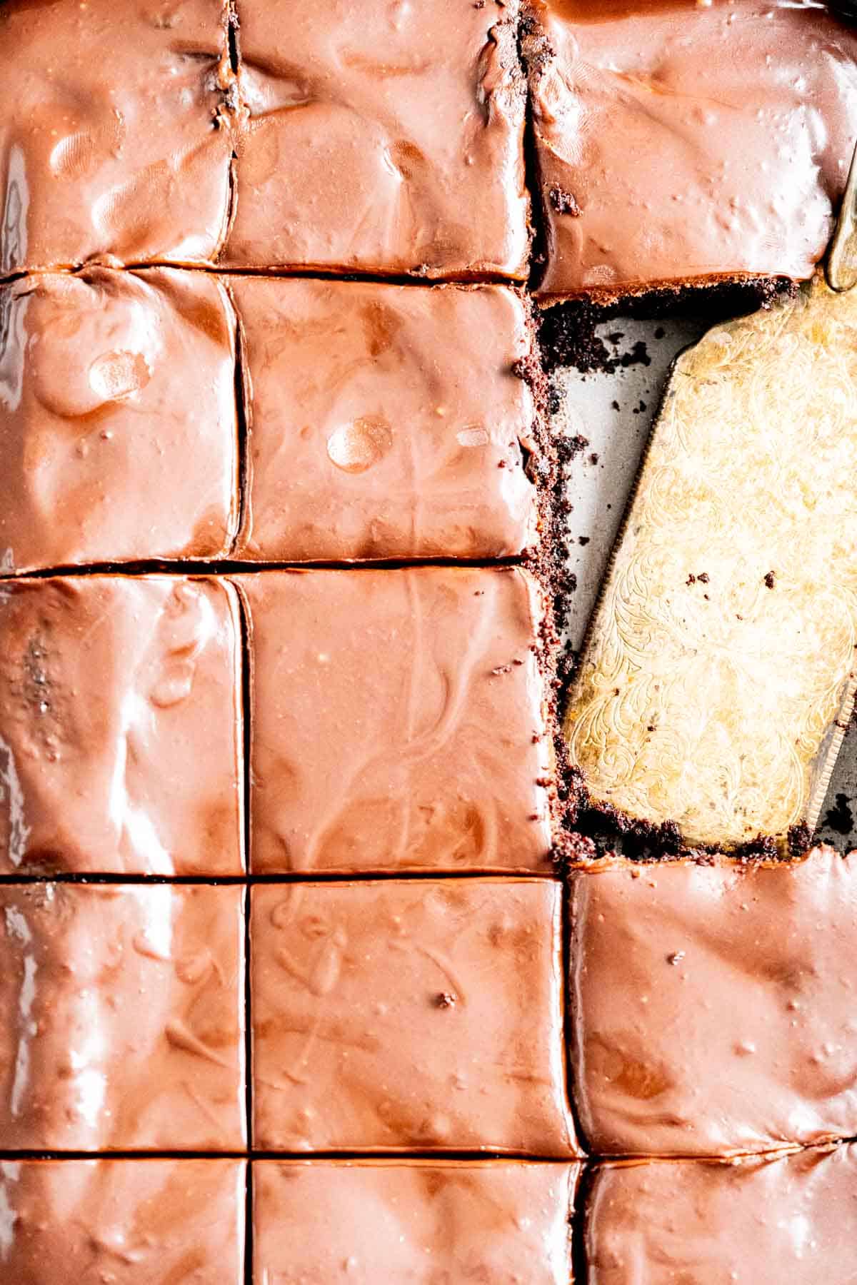 Chocolate mayonnaise cake pieces sitting in a sheet pan.