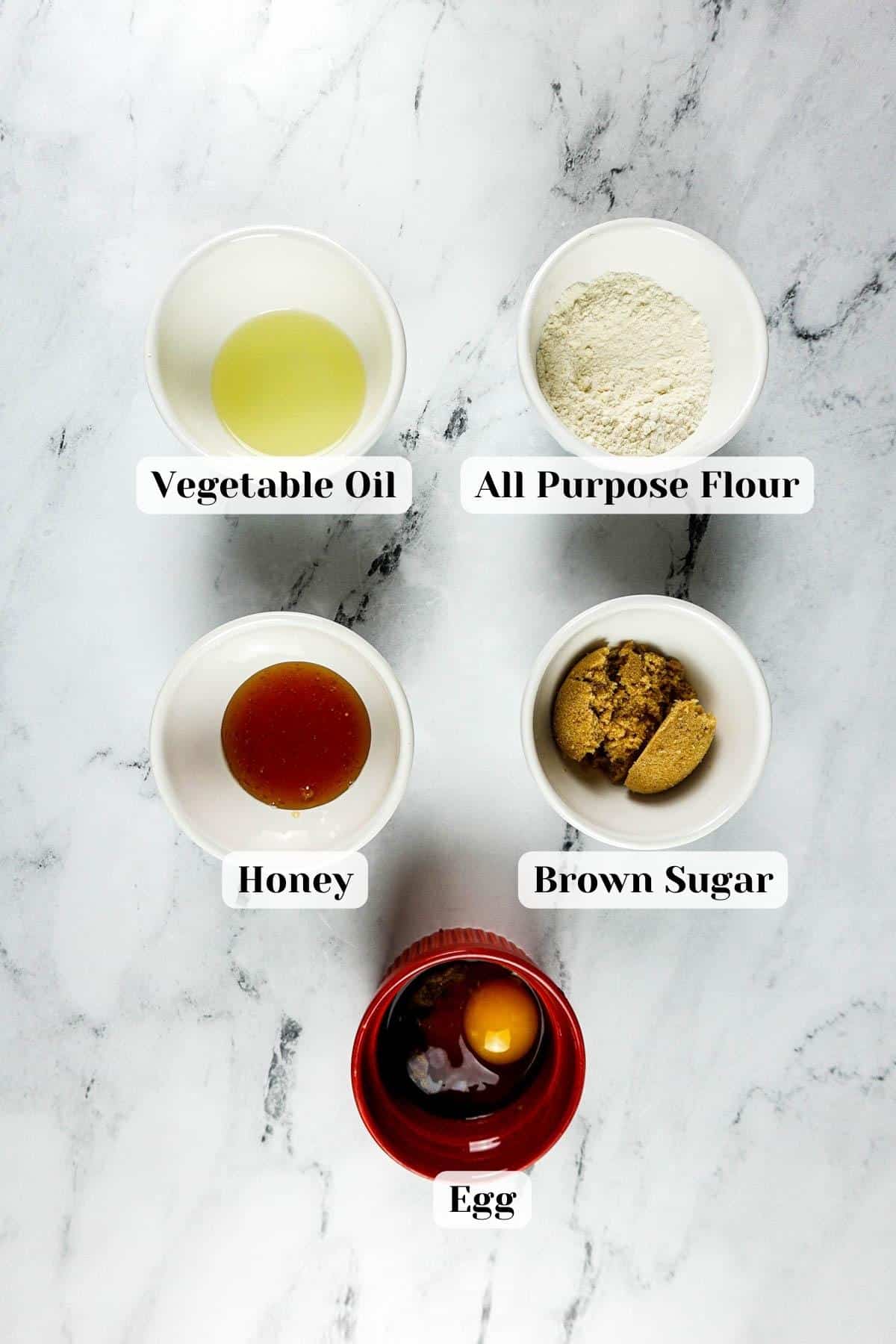 Ingredients for honey mug cake laid on a table.