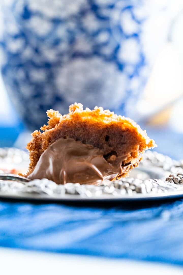 close shot of a piece of cake in an old tea spoon.