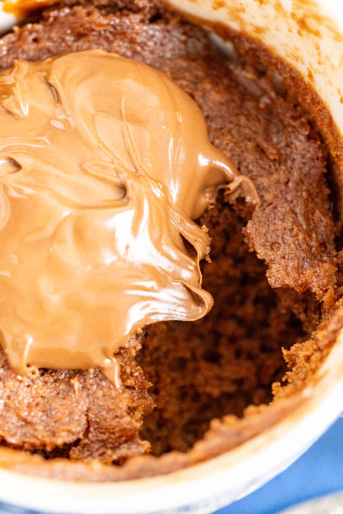 Nutella mug cake showing the texture of the cake in the mug. 