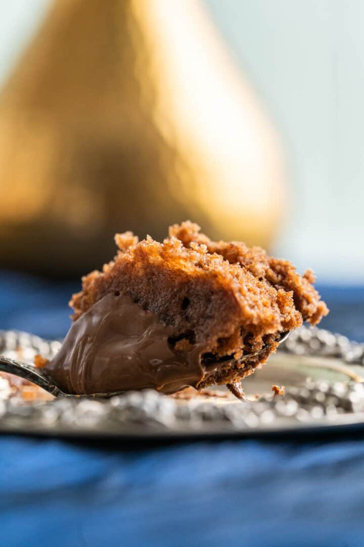 single piece of nutella mug cake on a spoon.