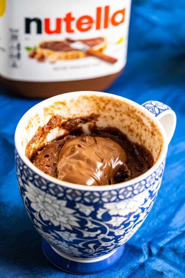 nutella cake in a blue and white mug.