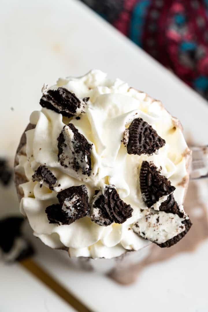 overhead shot of milkshake in a transparent glass.