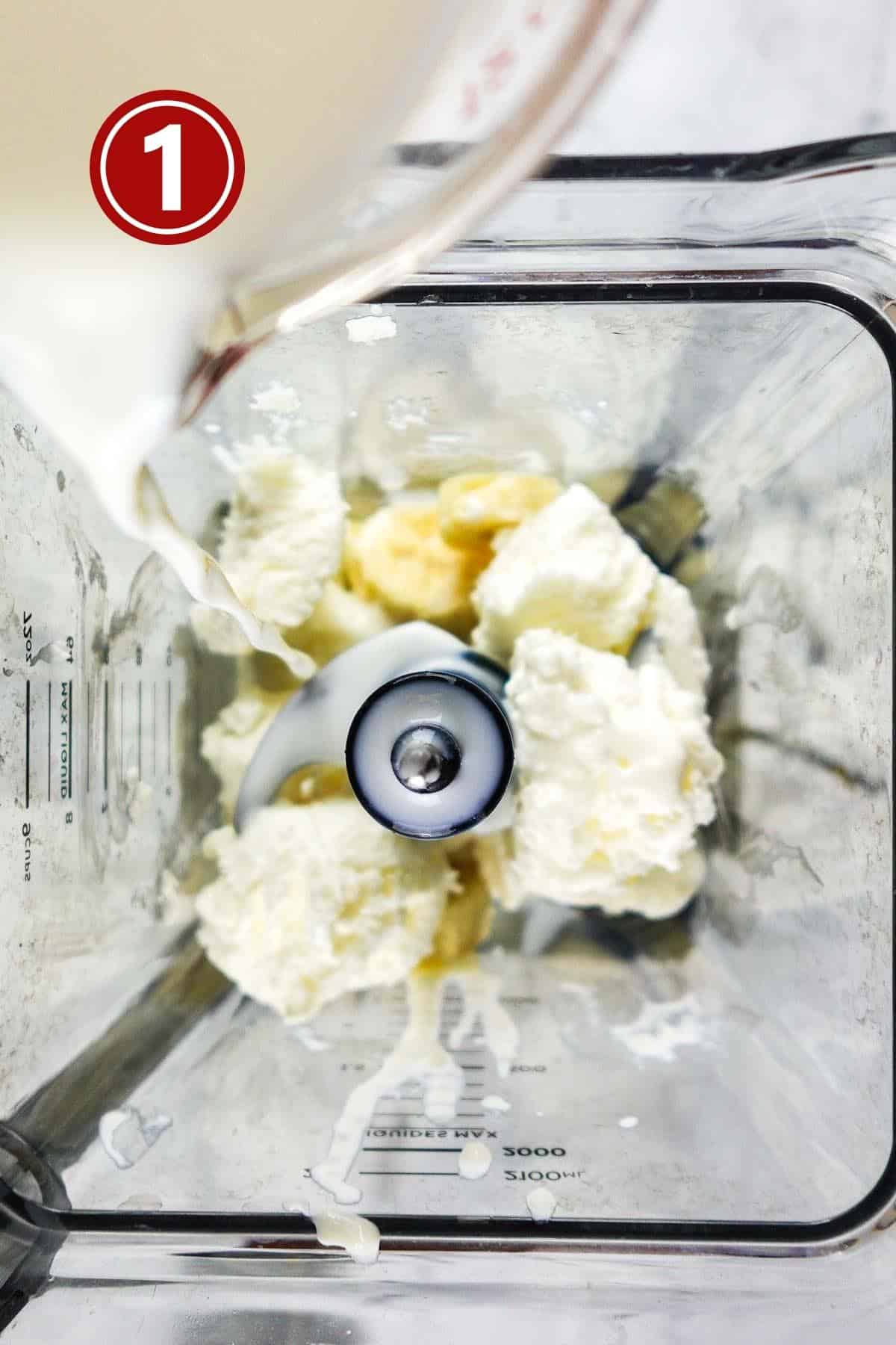 Ice creamand milk in the blender jar.