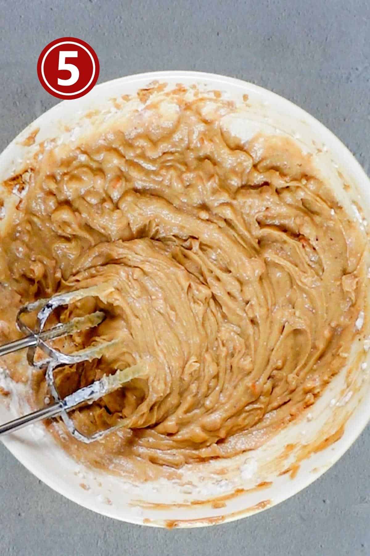 Adding the sour cream to the wet ingredients.