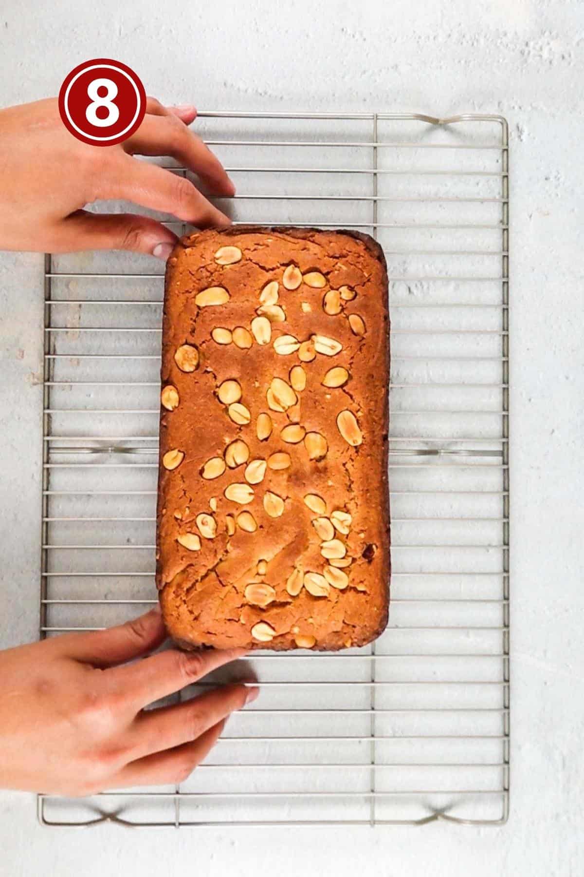 Baked peanut butter loaf placed over the wire rack.