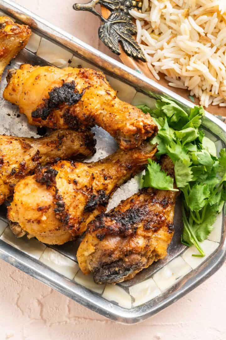 crispy chicken drumsticks in a plate close shot.