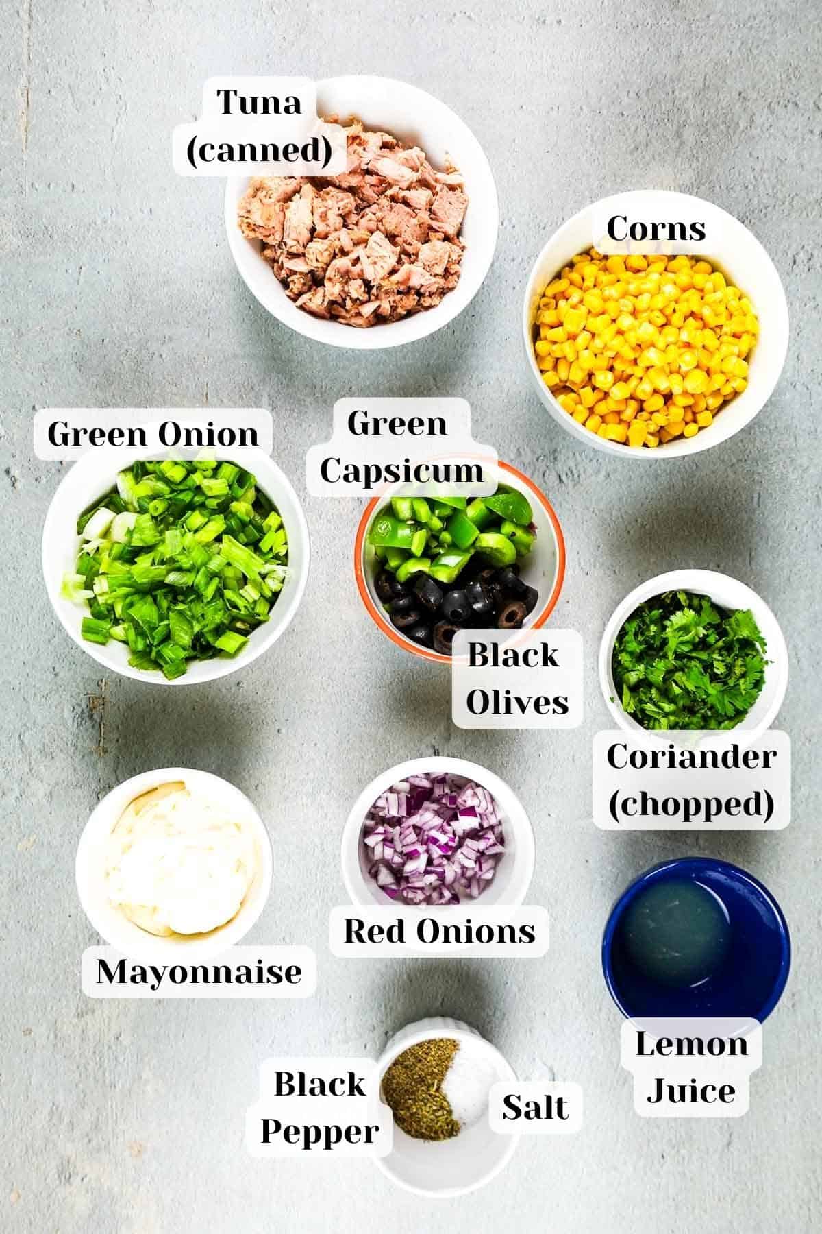 Ingredients for tuna corn salad on a table.