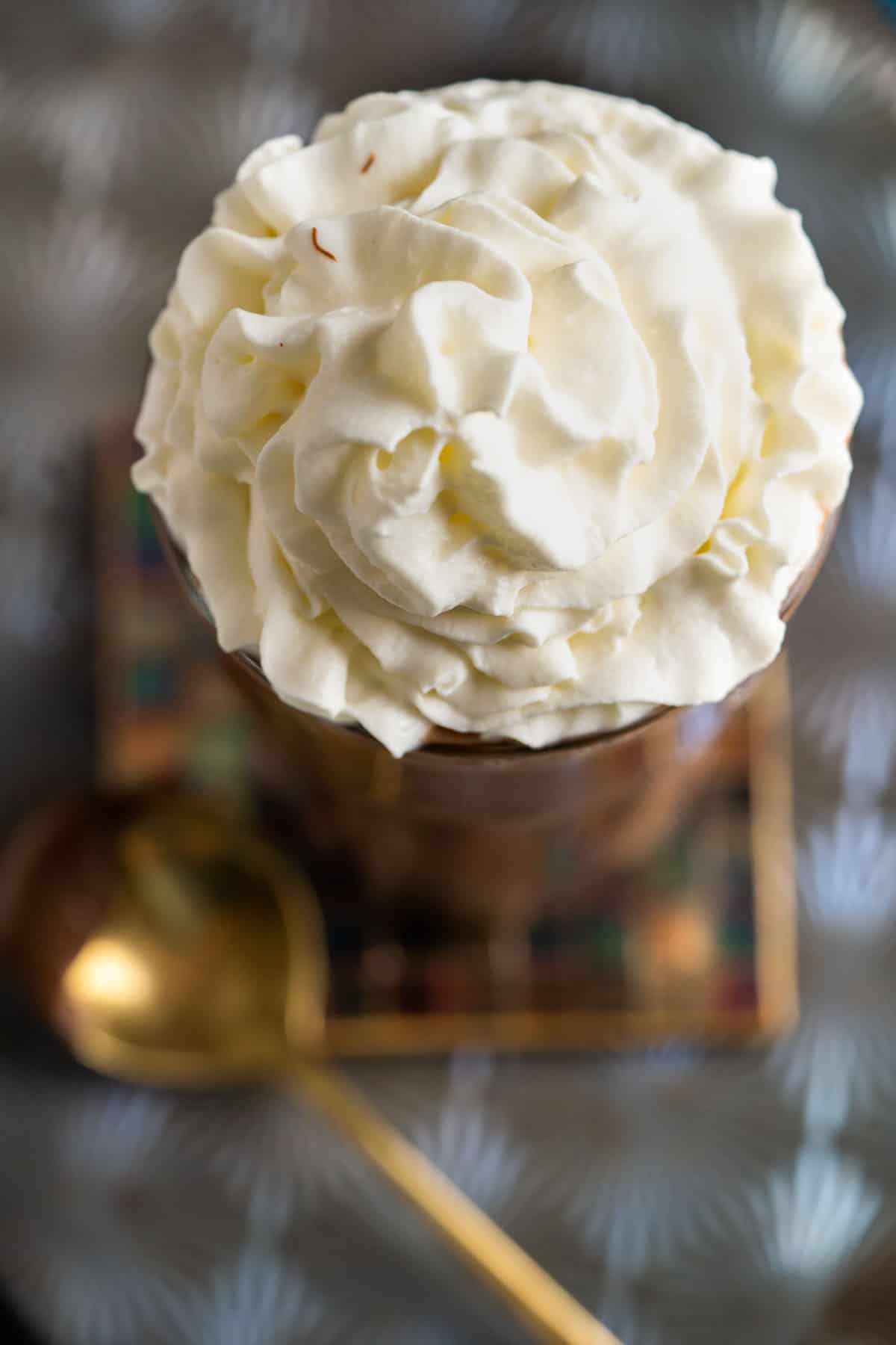 Nutella milkshake with whipped cream swirls on the top.