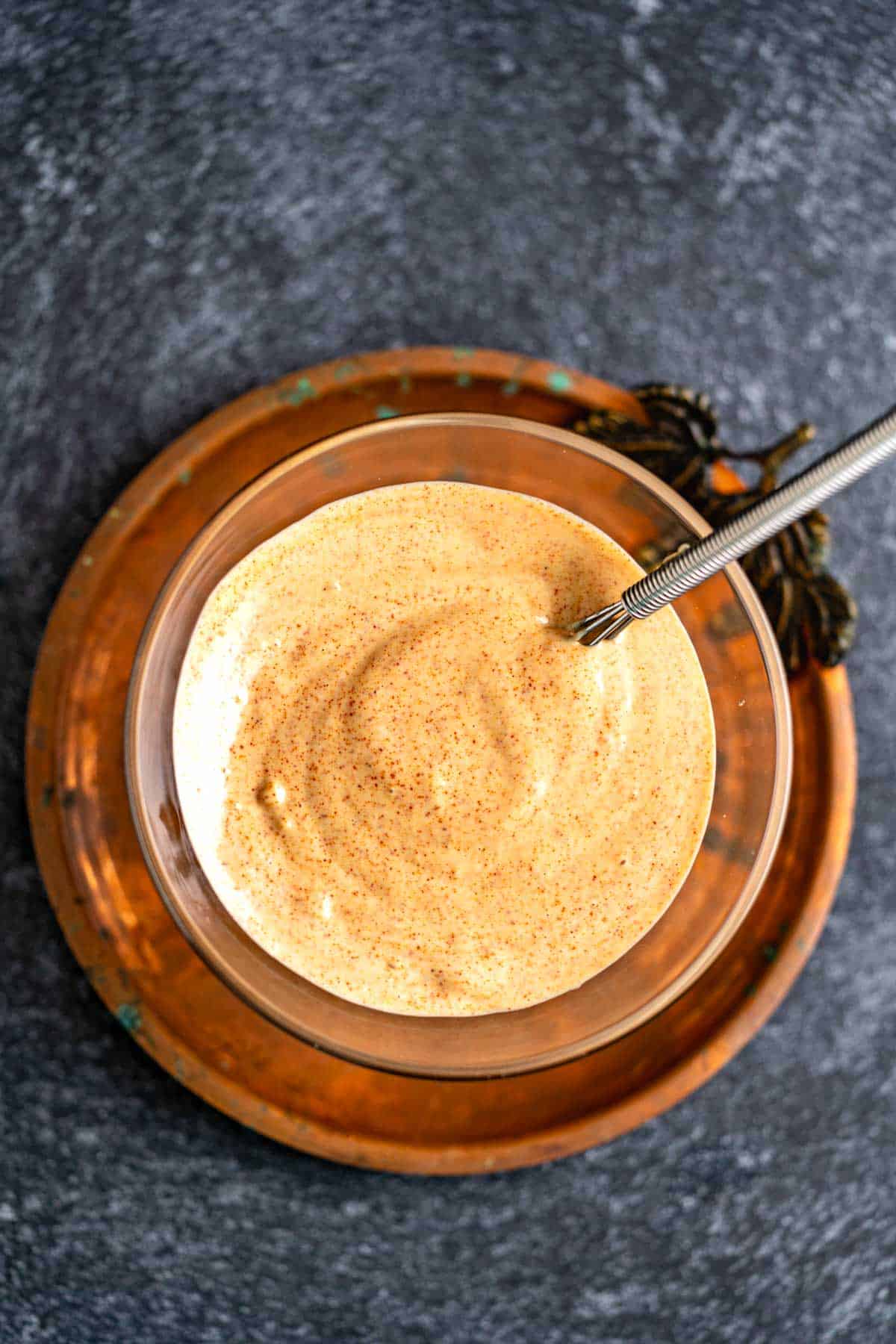 Peri peri mayonnaise in a transparent bowl.