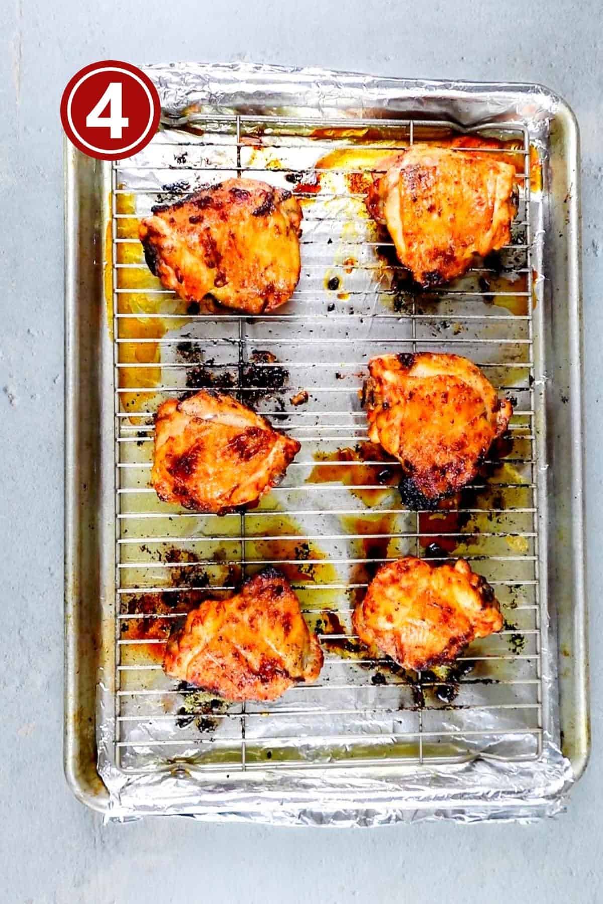 Baked chicken pieces on the baking tray.