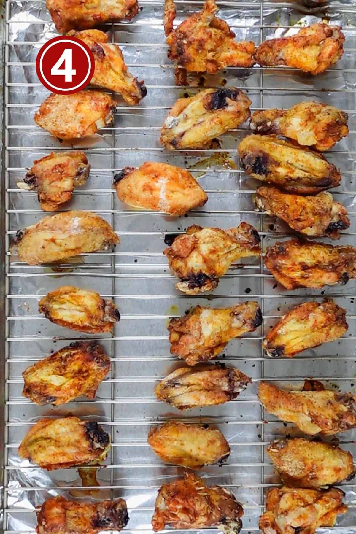 Baked chicken wings on the baking tray.