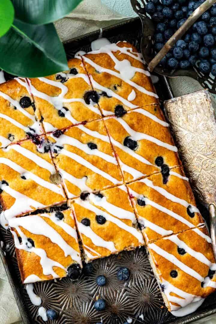 overhead shot of blueberry sheet cake in an old tray.